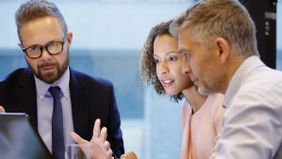 Man and woman discussion what a 1035 exchange is with their financial advisor