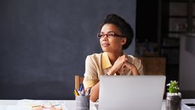 Woman reflecting on Northwestern Mutual’s Weekly Market Commentary.