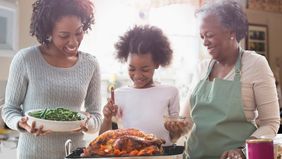 three-generations-of-women-cooking-together-in-kitchen