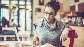 Woman working in a cafe