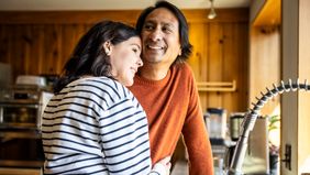 man and woman in kitchen