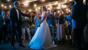 A couple dances in a wedding tent 