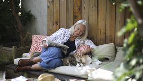  Portrait of an elderly woman posing on her terrace