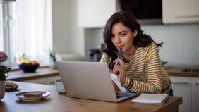 Woman reading about Bitcoin ETPs from Northwestern Mutual Wealth Management Company