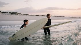 Father and son enjoy surfing trip while celebrating financial freedom and a solid plan with Northwestern Mutual
