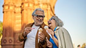 Senior couple enjoying ice cream together