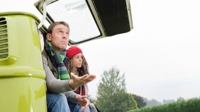 Couple thinking about what they read in the latest weekly market commentary from Northwestern Mutual.