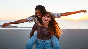 two friends laughing together