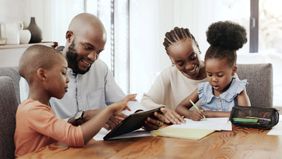 A family enjoys time together at the dining table.