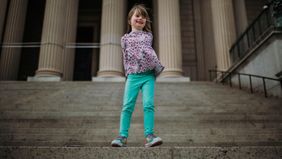 Girl on steps in Washington, DC on a financial vacation 