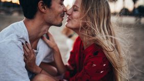 couple celebrating honeymoon on the beach