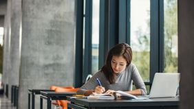 Woman studying in library