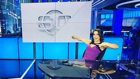 Victoria Arlen sitting at ESPN news desk