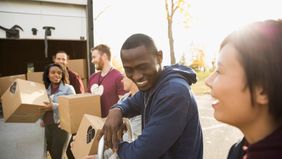 Volunteers loading boxes into truck.