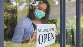 Small business owner reopening store