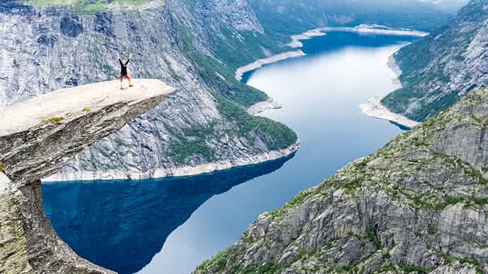 Canfield McNish hikes the Trolltunga cliff in Norway. 