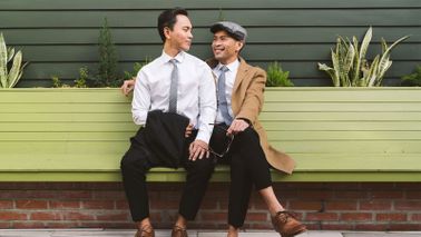 Married male couple discussing finances