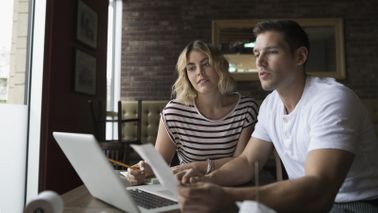 A young couple reviews their finances together