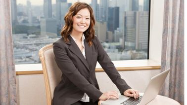 Businesswoman smiling about her year-end bonus