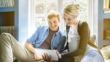 Couple taking a quiz to find out if they’re financially ready for a baby. 