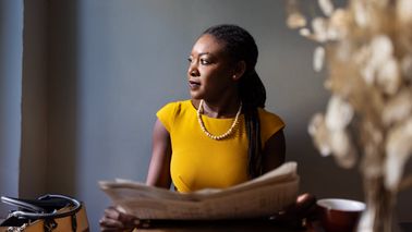 woman reading a newspaper