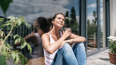 woman thinking about how to save more money in the new year