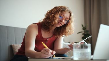young woman calculating spend