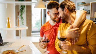 A couple enjoys time together in their kitchen 