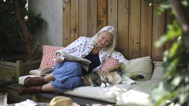  Portrait of an elderly woman posing on her terrace