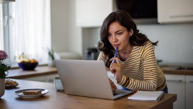 Woman reading about Bitcoin ETPs from Northwestern Mutual Wealth Management Company