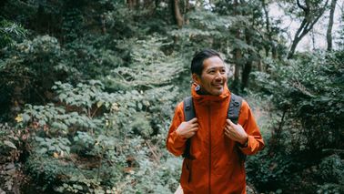 man hiking in the woods