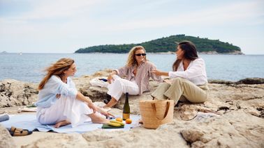 three friends enjoying time on the beach