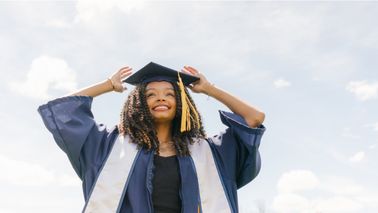Young woman celebrates high school graduation as she prepares for college 