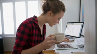 Woman researching the benefits of saving early and compound interest