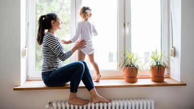 Mom and child looking outside after setting up a trust fund