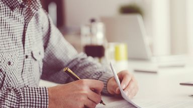 What happens to debt when you die man filling out paperwork