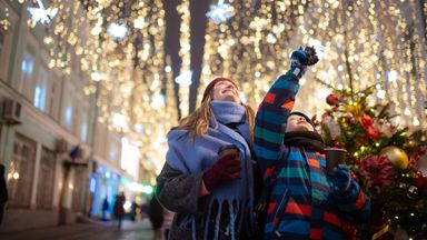 Mother and son explore holiday market while enjoying confidence in their financial plan with Northwestern Mutual.