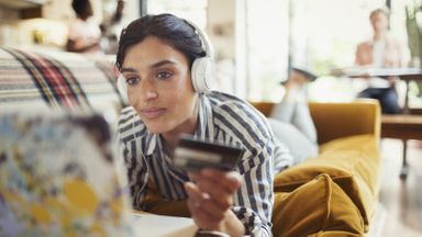 Woman using a credit card.