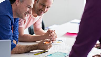 colleagues discussing business plan