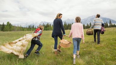 family having picnic to save money