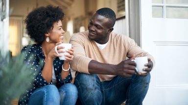 Newlywed couple having coffee and talking about money