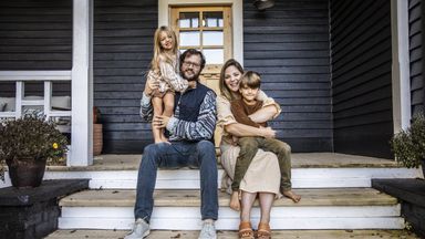 Family in front on home thinking about a HELOC vs. home equity loan