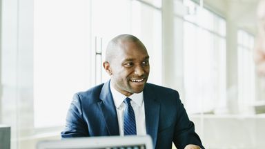 financially confident man in a meeting