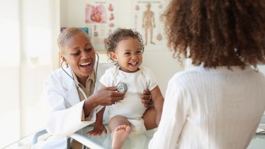 doctor listening to baby’s breathing