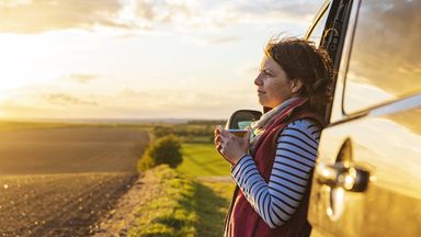 Woman thinking about how planning with Northwestern Mutual may be able to make a positive impact on her life.