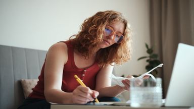 young woman calculating spend