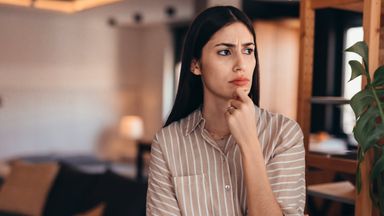 Woman thinking through a decision.