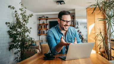 man smiling while having video call