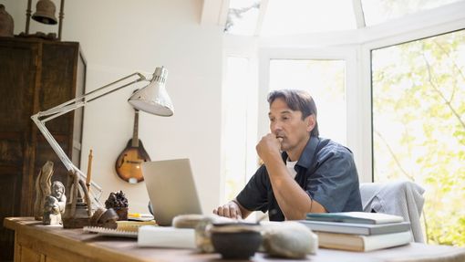 Man at desk researching reasons to consider a Roth 401k