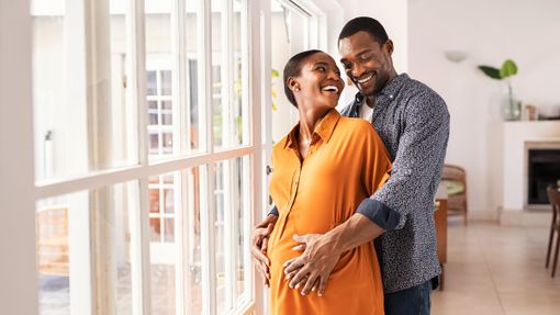 Pregnant couple thinking about life insurance for new parents